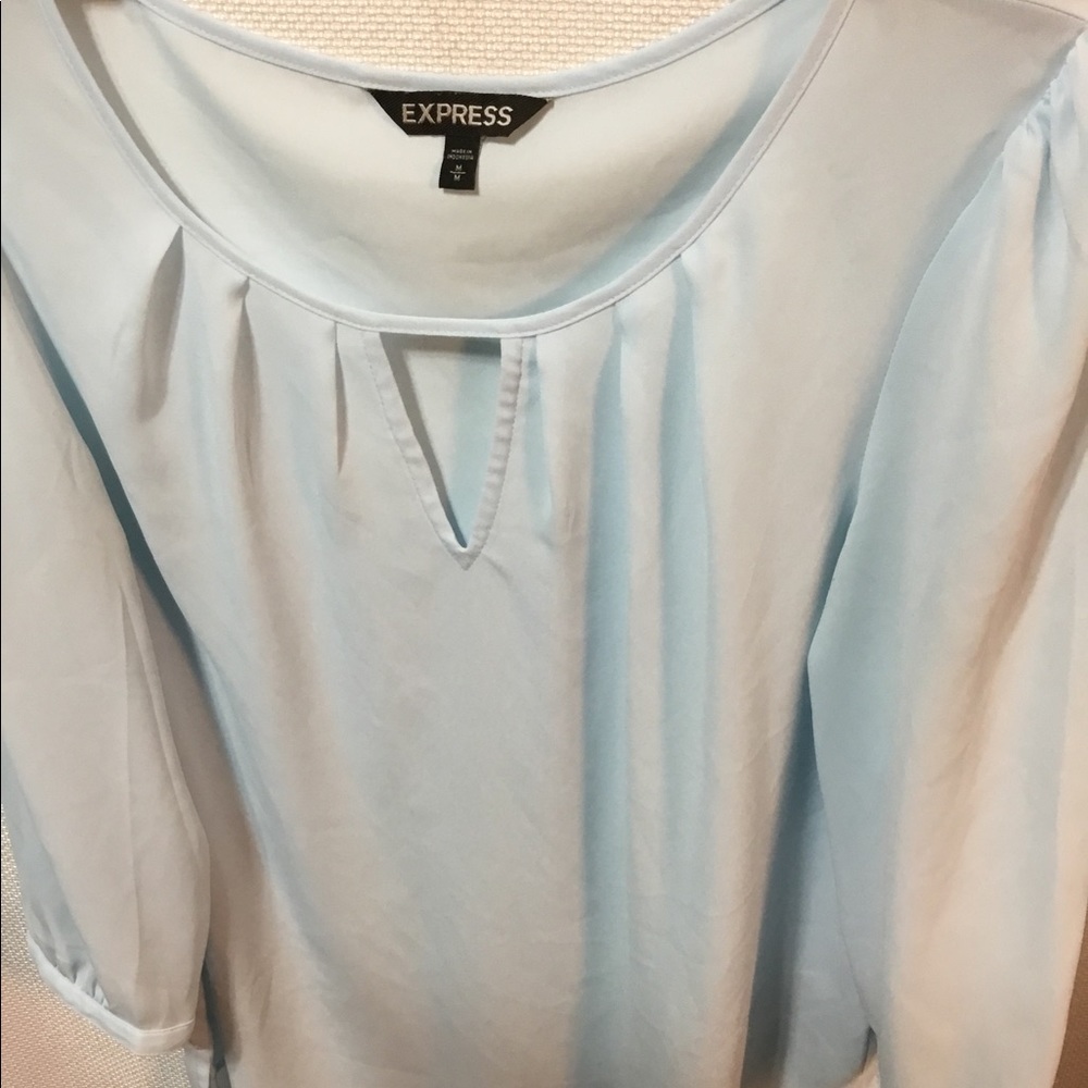 Pretty baby blue blouse by Express. EUC. Size medium.